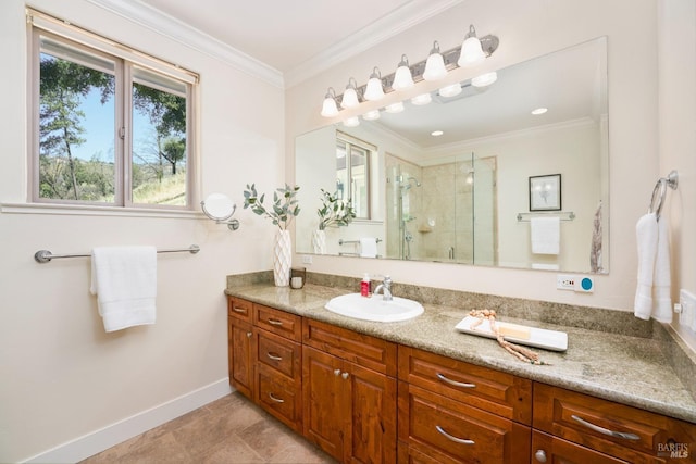 full bathroom with vanity, baseboards, a shower stall, tile patterned floors, and crown molding