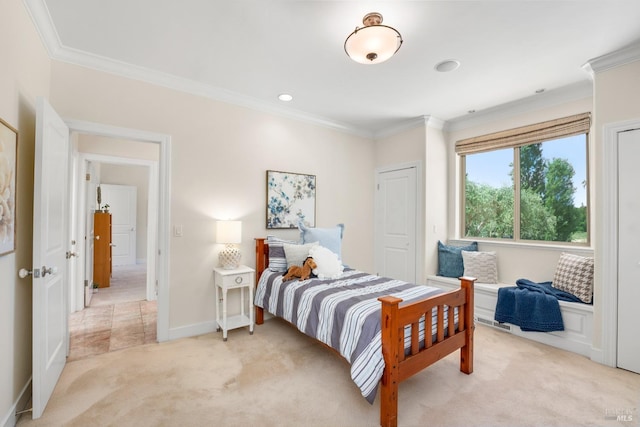 bedroom featuring ornamental molding, light carpet, and baseboards