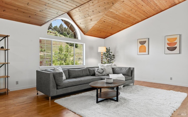 living area with wood ceiling, wood finished floors, baseboards, and high vaulted ceiling