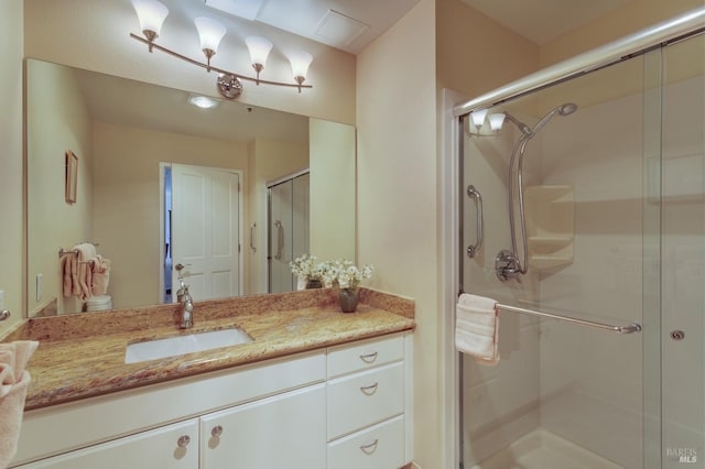 bathroom with vanity, toilet, and walk in shower