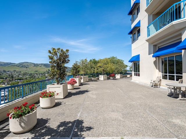 view of car parking with a mountain view