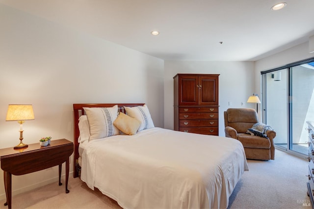 carpeted bedroom featuring access to outside and multiple windows