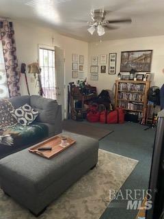 living room with carpet floors and ceiling fan