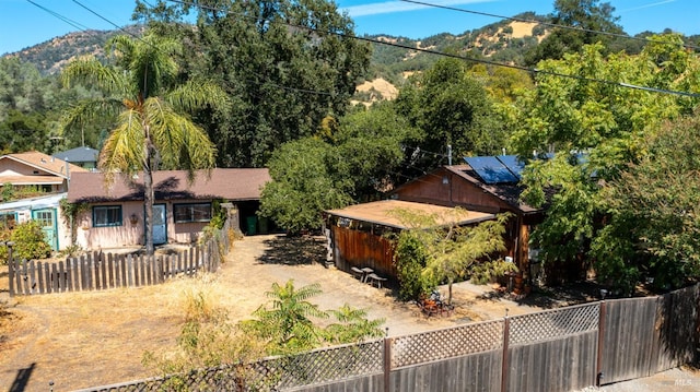 birds eye view of property with a mountain view