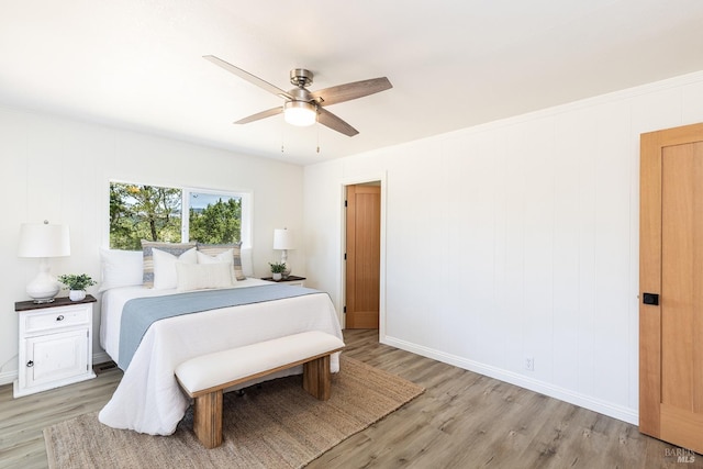 bedroom featuring ceiling fan and light hardwood / wood-style flooring