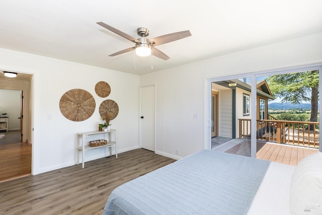 bedroom featuring access to exterior, ceiling fan, dark wood-type flooring, and ornamental molding