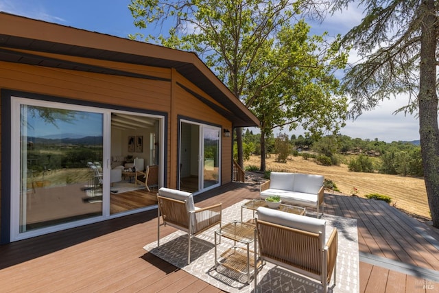 wooden terrace featuring an outdoor hangout area