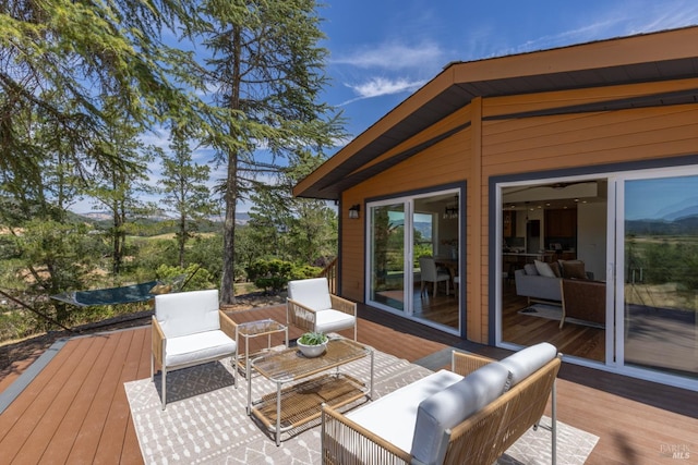 wooden deck featuring an outdoor living space