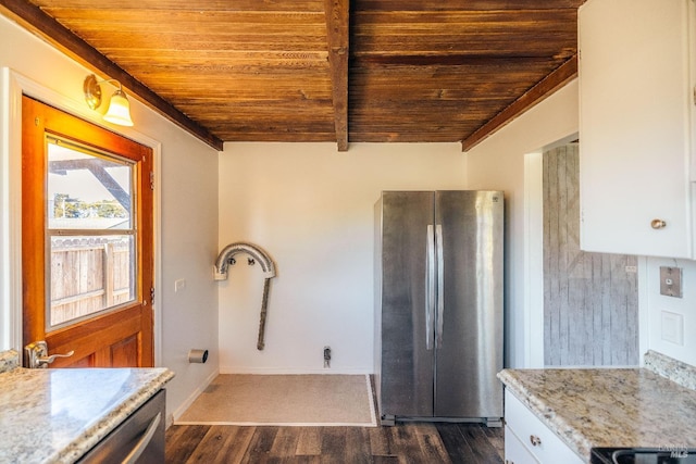 kitchen with wood ceiling, light stone countertops, dark wood-type flooring, and stainless steel fridge