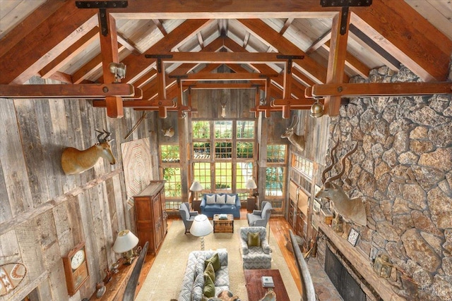 interior space featuring hardwood / wood-style floors, wooden ceiling, high vaulted ceiling, wood walls, and beamed ceiling