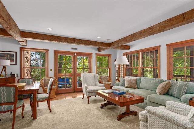 living room with beamed ceiling, french doors, and hardwood / wood-style floors