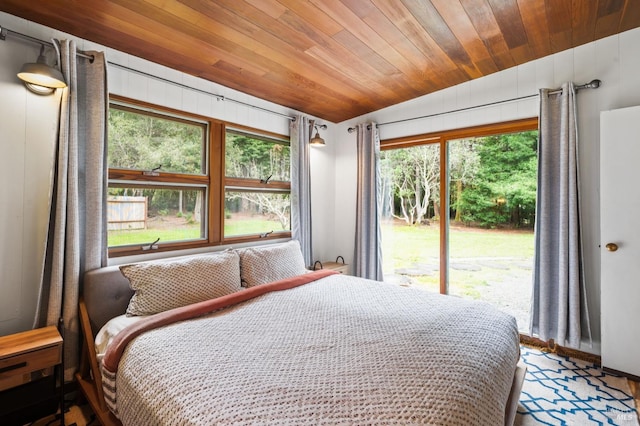 bedroom featuring wood ceiling, access to exterior, and vaulted ceiling