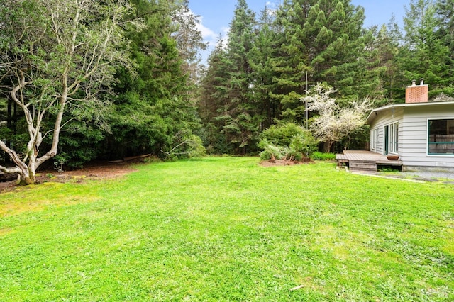 view of yard featuring a deck