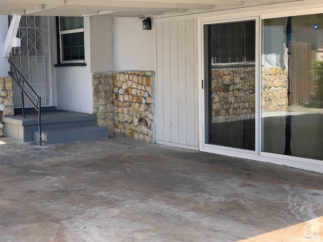 entrance to property with a patio area