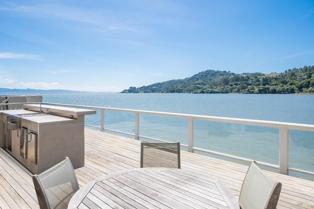 deck featuring a water and mountain view