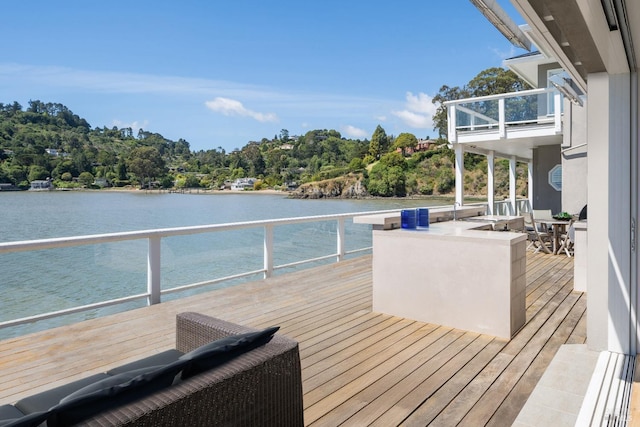 wooden terrace with a water view