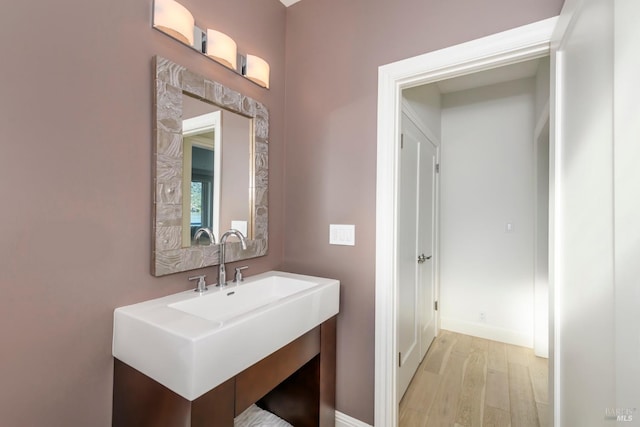 bathroom featuring hardwood / wood-style floors and sink