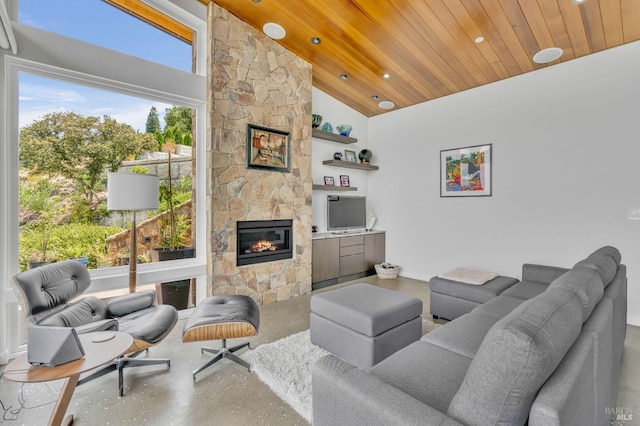 living room featuring concrete flooring, wood ceiling, high vaulted ceiling, and an outdoor stone fireplace