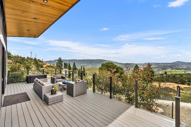 wooden terrace featuring outdoor lounge area and a mountain view