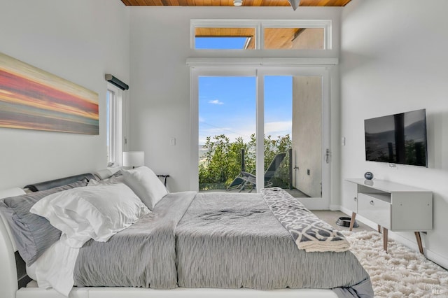 carpeted bedroom featuring access to outside