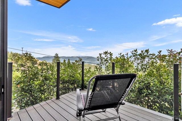 wooden terrace with a mountain view