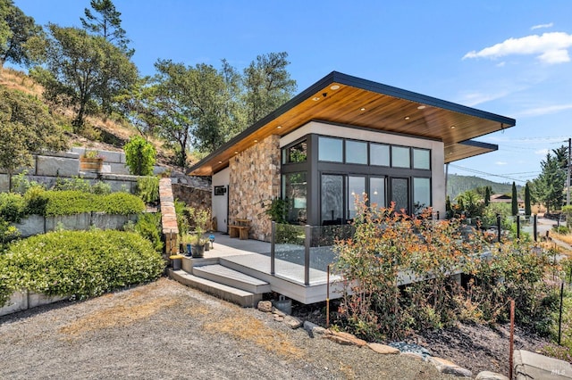 view of home's exterior featuring a deck