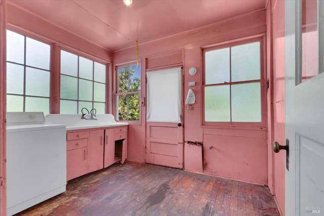 kitchen with washer / clothes dryer, dark hardwood / wood-style floors, and sink