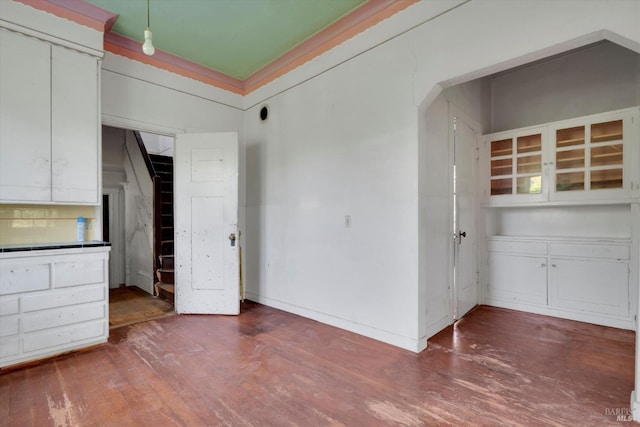 unfurnished dining area featuring hardwood / wood-style floors