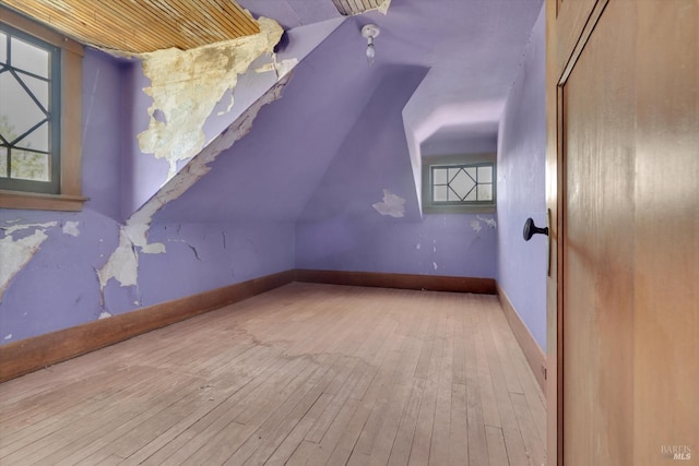 bonus room with hardwood / wood-style floors