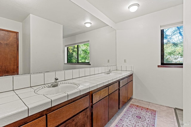 bathroom with vanity and a healthy amount of sunlight