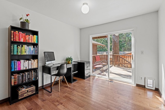 office space with hardwood / wood-style flooring