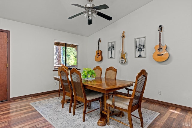 dining room with ceiling fan, hardwood / wood-style floors, and lofted ceiling