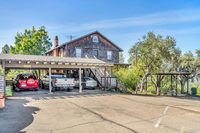 view of parking / parking lot with a carport
