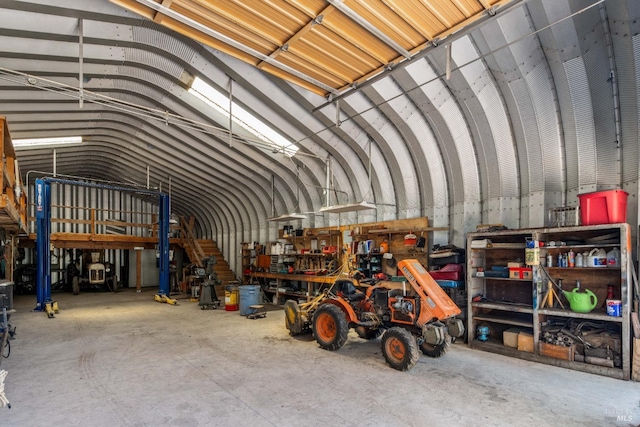 interior space with lofted ceiling and concrete floors