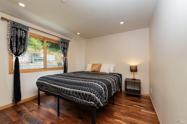 bedroom featuring dark hardwood / wood-style floors