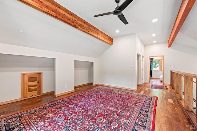 additional living space featuring vaulted ceiling with beams, hardwood / wood-style flooring, and ceiling fan