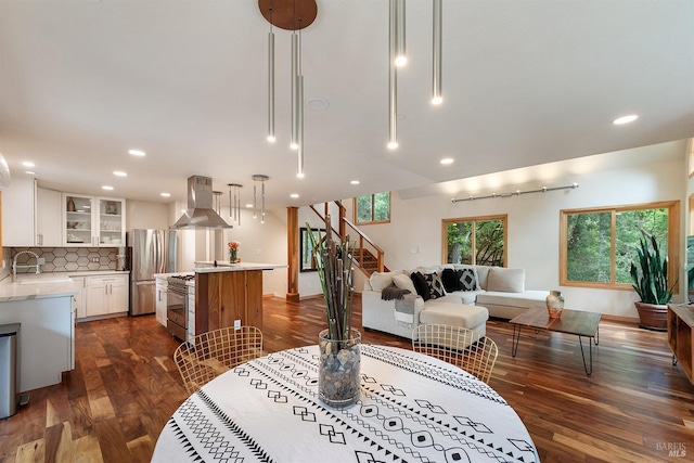 living room featuring dark wood-type flooring and sink