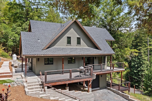 back of property featuring a deck