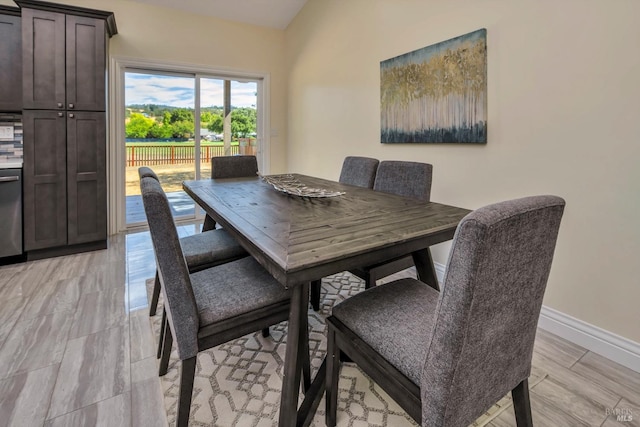 dining space with light hardwood / wood-style floors