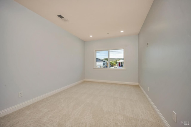 empty room with light colored carpet