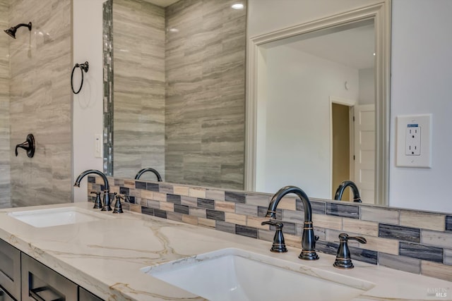 bathroom featuring decorative backsplash and vanity