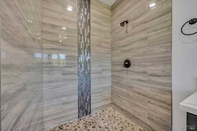 bathroom with tiled shower