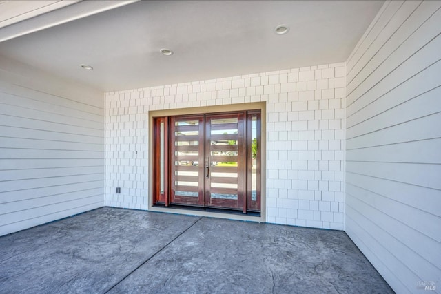 view of exterior entry featuring french doors