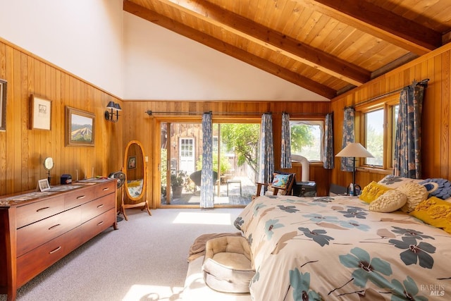 bedroom featuring beam ceiling, access to exterior, wood walls, carpet, and wood ceiling