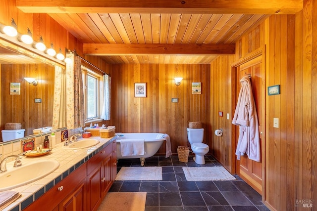 bathroom featuring tile patterned floors, a bathtub, beam ceiling, and wooden walls