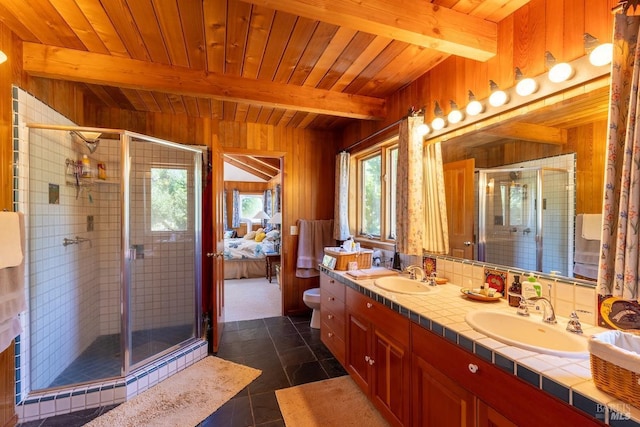 bathroom featuring beam ceiling, wooden ceiling, tile patterned flooring, wooden walls, and a shower with door