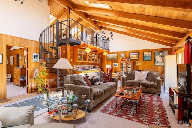 living room with beamed ceiling, carpet, high vaulted ceiling, and wood walls