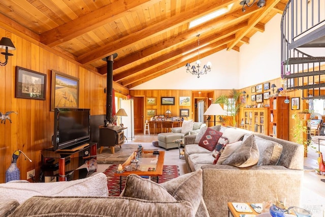 living room with beam ceiling, a wood stove, high vaulted ceiling, and a notable chandelier