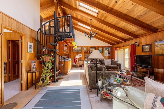 living room featuring beam ceiling, a skylight, and high vaulted ceiling