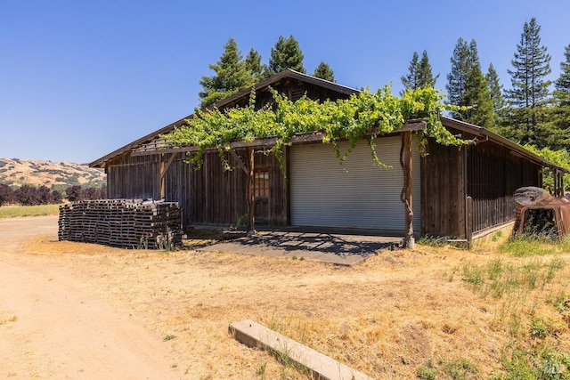 view of property exterior featuring a mountain view